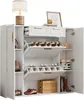 A white shoe cabinet with multiple shelves and drawers, displaying various shoes and decorative items. Produktbild-Vorschau