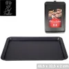A black baking tray is shown from a top-down perspective, with a smaller image of the product packaging in the upper right corner. Produktbild-Vorschau