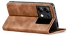 A brown leather flip case for a smartphone is shown standing upright. Produktbild-Vorschau