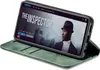 A green flip case for a smartphone is shown open, with the phone displaying a movie interface. Produktbild-Vorschau