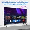 A modern television displaying a smart TV interface with various app icons and content recommendations. Produktbild-Vorschau