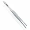 A stainless steel kitchen tweezer is shown on a white background with its reflection. Produktbild-Vorschau