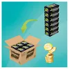 A cardboard box filled with Pampers Ninjamas products, a stack of Pampers Ninjamas products, and a stack of gold coins, with a green arrow indicating movement. Produktbild-Vorschau