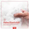 A hand is shown squeezing a fluffy white material, likely a pillow filling. Produktbild-Vorschau