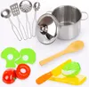 A collection of toy kitchenware, including pots, utensils, and play food, arranged on a white background. Náhled obrázku produktu