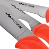 Close-up of knife blades with orange handles. Náhled obrázku produktu