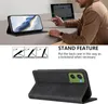 A person is using a phone with a case that is propped up as a stand, next to a laptop. Produktbild-Vorschau