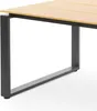 A close-up of a table leg and part of the tabletop. Náhled obrázku produktu