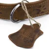 Close-up of a leather dog collar with a tag. Produktbild-Vorschau