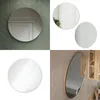 A collage of images showing round mirrors in different settings and styles. Náhled obrázku produktu