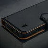 Close-up of a black leather iPhone case with a brown interior and a small embossed logo. Produktbild-Vorschau