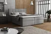 A bedroom scene with a boxspring bed as the main focus. Voir les images du produit