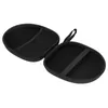 An open black carrying case for headphones, showing the interior compartments. Voir les images du produit