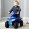 A baby is riding a blue toy quad bike indoors. Produktbild-Vorschau