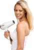 A woman is holding a white hairdryer. Náhľad obrázku produktu