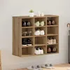 A shoe cabinet mounted on a wall, filled with various shoes. Náhled obrázku produktu