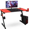 A gaming desk setup with a monitor, keyboard, mouse, and computer tower.