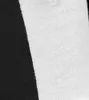 A close-up view of a black and white fabric, likely a textile product. Produktbild-Vorschau