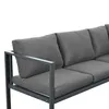 A close-up view of a grey outdoor sofa with cushions. Produktbild-Vorschau