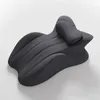 A dark gray, ergonomically shaped pillow designed for intimate use, resting on a white background. Produktbild-Vorschau