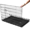 A person's hand is shown adjusting a black metal dog crate that is partially unfolded. Podgląd zdjęcia produktu