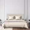 A bed with a headboard, pillows, and a blanket. Produktbild-Vorschau