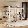 A loft bed with a desk and shelves underneath, set up in a room. Anteprima dell’immagine prodotto