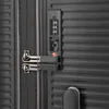 A close-up view of a black suitcase lock and zipper. Produktbild-Vorschau