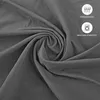 Close-up of dark gray fabric, showing its texture and a swirl, with icons for breathability and machine washability Anteprima dell’immagine prodotto