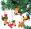 Wooden train ornaments hanging on a Christmas tree. Podgląd zdjęcia produktu