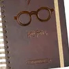 A close-up view of a Harry Potter themed spiral notebook. Produktbild-Vorschau
