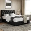 A bedroom scene with a black upholstered bed. Produktbild-Vorschau
