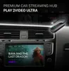 A car's dashboard with a streaming device plugged in and a movie playing on the car's screen. Produktbild-Vorschau