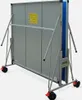 A folded outdoor table tennis table with wheels, viewed from the side. Produktbild-Vorschau