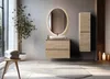 A modern bathroom vanity with a sink and mirror, accented by a potted plant and towels. Náhled obrázku produktu