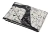 A folded blanket with a dog pattern. Produktbild-Vorschau