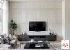 A modern living room with a TV, sofa, and coffee table. Produktbild-Vorschau