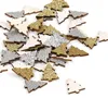 A pile of small, glitter-covered wooden Christmas tree decorations in gold, silver, and white. Produktbild-Vorschau