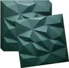 A stack of green 3D wall panels with a geometric design, with one panel in the foreground. Podgląd zdjęcia produktu