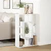 A white bookshelf is shown in a room with a couch and artwork in the background. Náhled obrázku produktu