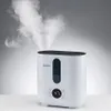 A white humidifier emitting steam, placed on a white surface against a light gray background. Produktbild-Vorschau