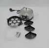 An egg cooker and its accessories are laid out on a white background. Produktbild-Vorschau