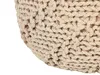 A close-up view of a beige knitted pouf. Náhled obrázku produktu