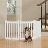 A dog sits in front of a white wooden pet gate in a home setting, with stairs visible in the background. Podgląd zdjęcia produktu