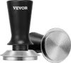 A black VEVOR espresso tamper with a silver base and a separate silver tamper base with a concentric circle pattern, shown against a white background. Produktbild-Vorschau
