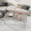 A modern living room scene with a sectional sofa and a mirrored coffee table. Anteprima dell’immagine prodotto