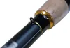 A close-up view of a fishing rod handle with a gold accent and a small loop. Anteprima dell’immagine prodotto