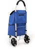 A blue shopping trolley with two wheels is shown against a white background. Voir les images du produit