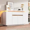 A white sideboard with wood accents and LED lighting, decorated with framed pictures and a vase of flowers. Anteprima dell’immagine prodotto