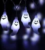 A string of ghost-shaped Halloween lights against a dark background. Produktbild-Vorschau